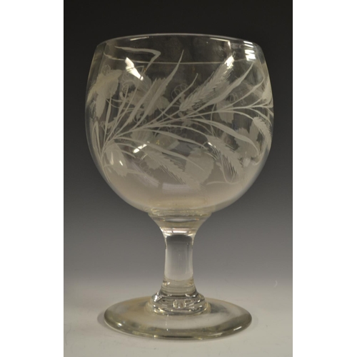 218 - A substantial George III/IV century glass rummer, the bowl etched and engraved with hops, circular f... 