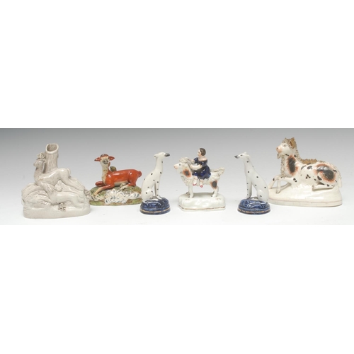 23 - A pair of Staffordshire dalmations, seated, on blue mounds, 10cm high, c.1870;   an early 19th centu... 