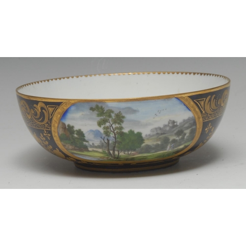 260 - An 18th century Sevres bowl, finely  painted with landscape in etched gilt  oval cartouche, on a cob... 