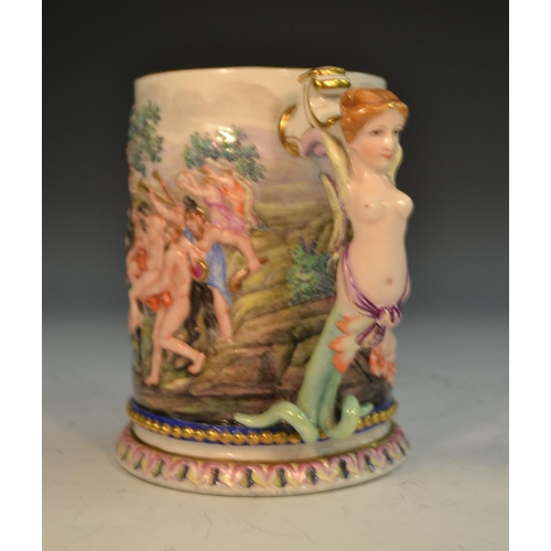 263 - An Italian porcelain mug, moulded in relief and brightly decorated with a scene from Classical mytho... 