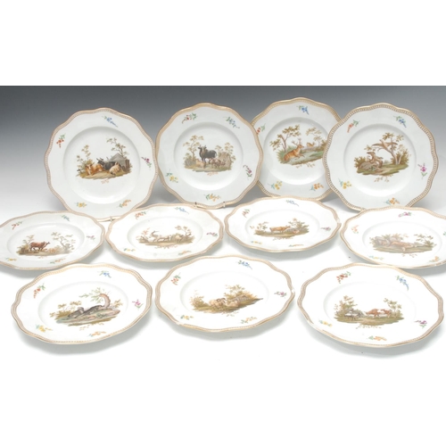 266 - A set of eleven Meissen shaped circular plates, painted with cattle, sheep, beavers, deers, the rim ... 