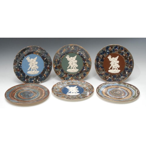 28 - A pair of Thomas Fradley circular plates, applied in white relief with cherubs, marbled border in bl... 