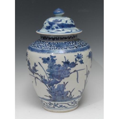 280 - A 17th century Japanese Arita ovoid vase, painted in underglaze blue with flowers and foliage, assoc... 