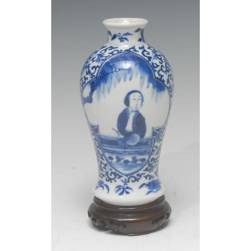 281 - A 19th century baluster vase, decorated in underglaze blue, with shaped reserves, the ground with sc... 