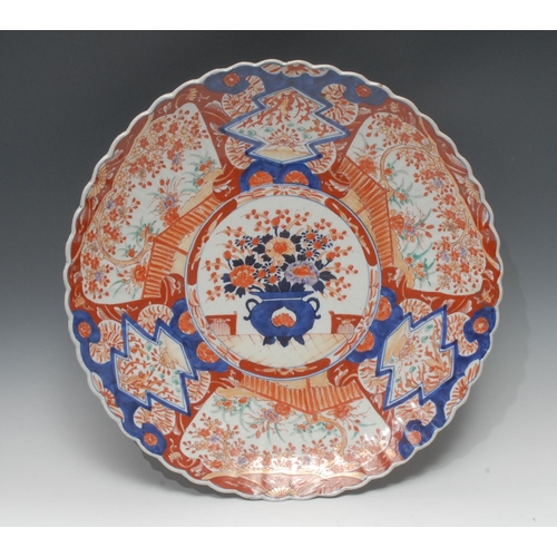 285 - A 19th century Japanese Imari charger, decorated with jardiniere of flowers and foliage, 46.5cm diam... 