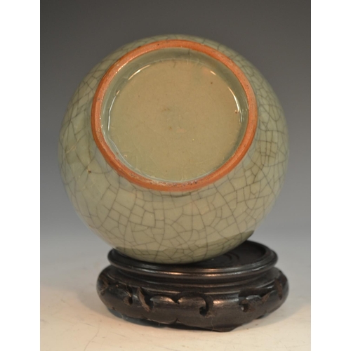 290 - A Chinese crackle glaze celadon ovoid bottle vase, 24cm high, 19th century, hardwood stand