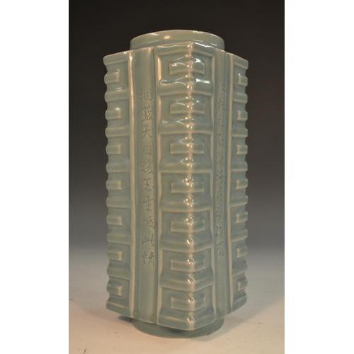 296 - A Chinese monochrome cong vase, incised with script and glazed in tones of pale blue, 22.5cm high