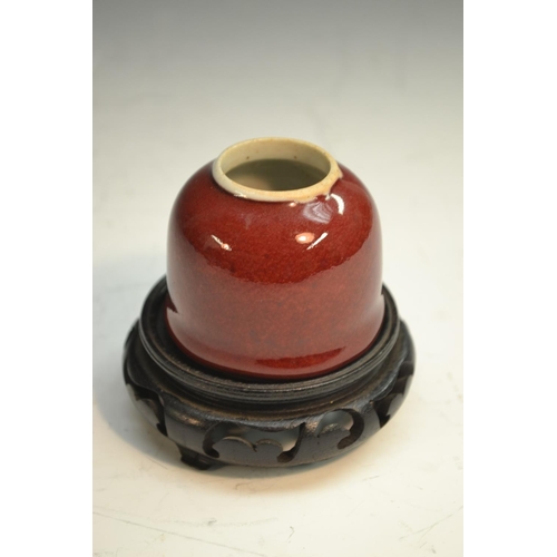 297 - A Chinese monochrome 'taibai zun' brush washer, mottled red/peach bloom glaze, 5cm high, 19th centur... 