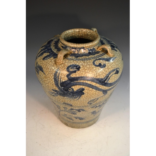 304 - A Chinese Zhangzhou or Swatow ware baluster wine jar, the crackle ground painted in underglaze blue ... 