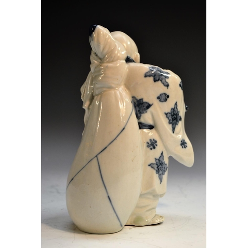 306 - A Japanese porcelain figure, of Hotai, smiling, carrying his sack, 21cm high, Meiji period