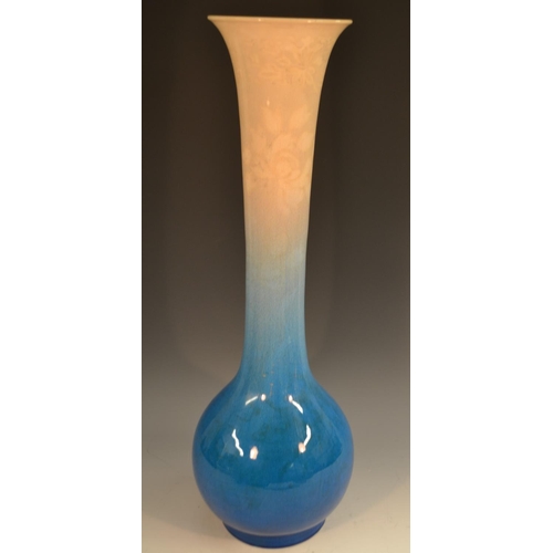 314 - A large Japanese Awaji trumpet shaped bottle vase, glazed in graduating tones of pale blue and cream... 