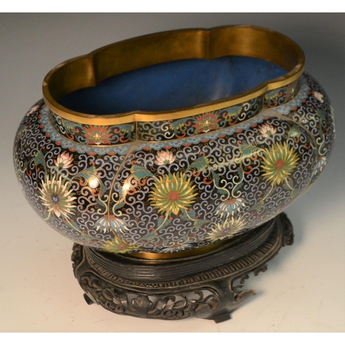 342 - A Chinese cloisonné lobed ovoid jardiniere, profusely decorated in polychrome with lotus, flowers an... 