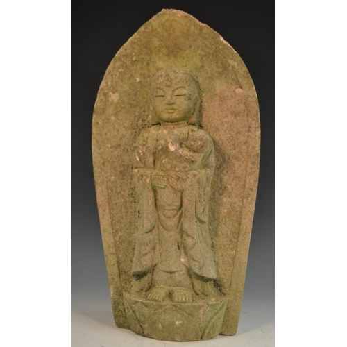 347 - A Chinese limestone shrine figure, carved as Buddha cradling an infant, within a lotus, 46cm high, 1... 