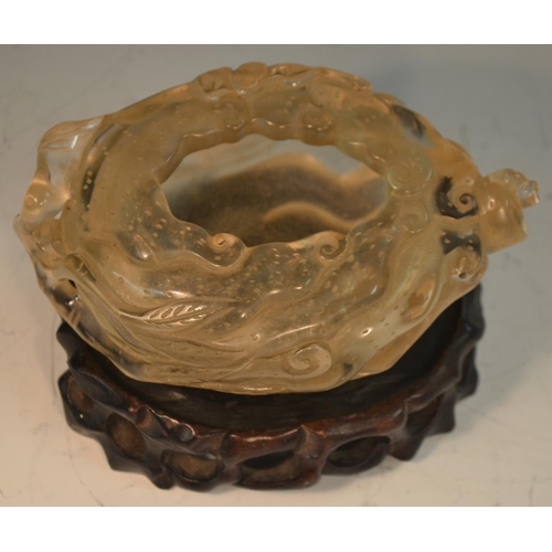 350 - A Chinese rock crystal scholar's brush washer, of organic form and carved in the Confucian taste wit... 