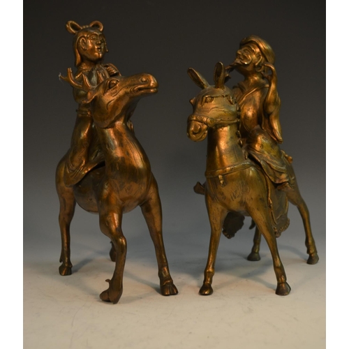 357 - A pair of Chinese gilt bronze censers and covers, cast as immortals mounted upon a horse and a deer,... 