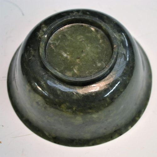 358 - A spinach jade bowl, 12cm diam, on  stand