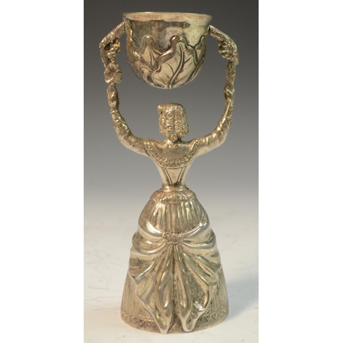 573 - A Continental silver plated wager cup, typically cast as a lady, finely dressed in a long gown, 16.5... 