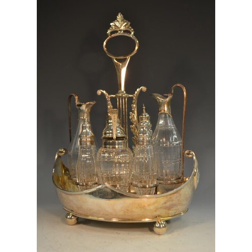 574 - A George III Old Sheffield Plate boat shaped seven bottle cruet, lyre shaped posted handle, facet-cu... 