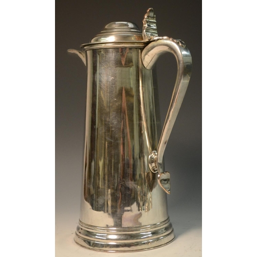 577 - A George III Old Sheffield Plate spreading cylindrical flagon, hinged domed cover with shaped thumbp... 