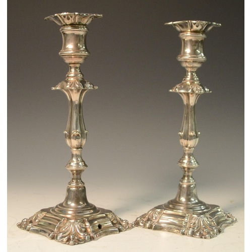 580 - A pair of George II Revival E.P on copper candlesticks, drilled as table lamps, shells to angles, 25... 