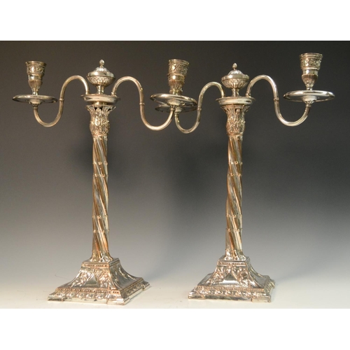 581 - A pair of George III Neo-Classical Old Sheffield Plate two-light, two-branch table candelabra, urnul... 