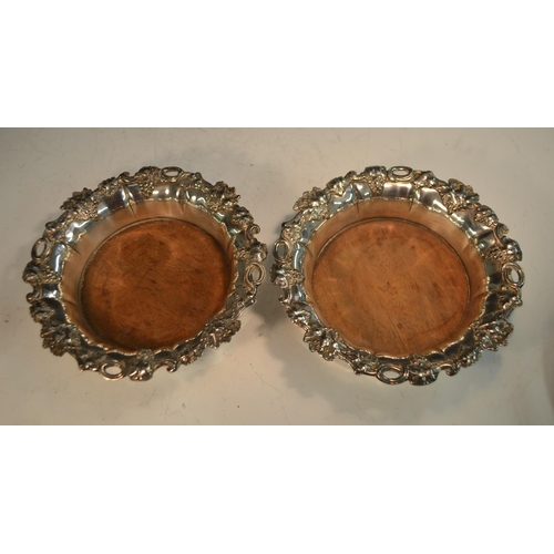 582 - A pair of George/William IV Old Sheffield Plate fluted shaped circular wine coasters, fruiting vine ... 