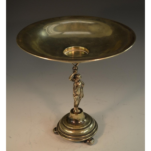 594 - An E.P.N.S table centrepiece, circular dish above a Classical figure, circular base with bun feet, 2... 