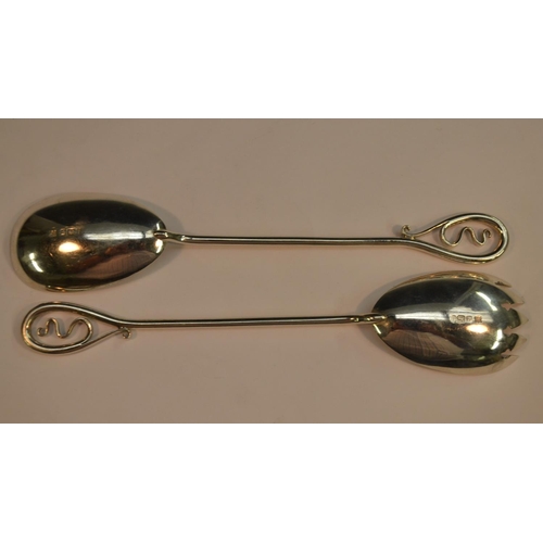 618 - A pair of Art Nouveau silver fruit spoons, the long hafts with sinuous terminals, Fenton Brothers Lt... 