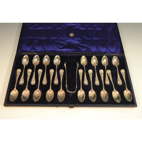 621 - A set of eighteen Victorian silver teaspoons, embossed and engraved in the Rococo taste with shells ... 