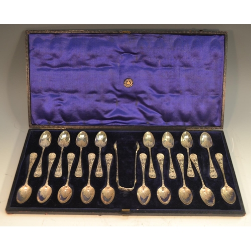 621 - A set of eighteen Victorian silver teaspoons, embossed and engraved in the Rococo taste with shells ... 