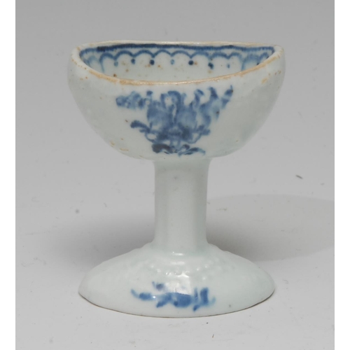 64 - A Lowestoft eye bath, painted painted in underglaze blue with sprays of flowers, 'line, loop and dot... 