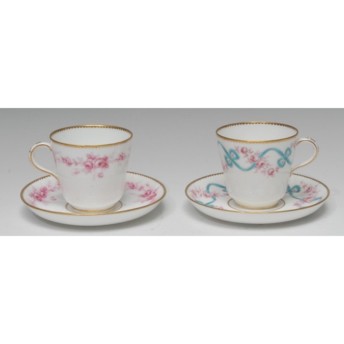 65 - A Minton coffee cup and saucer,  painted with turquoise ribbons and red roses, gilt dentil rims, pat... 