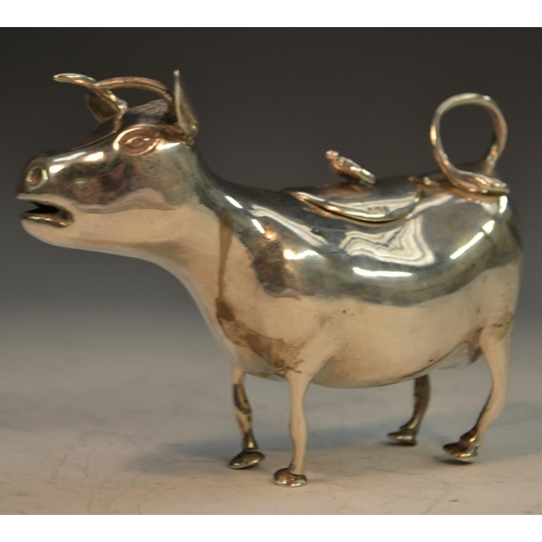 654 - A 19th century Continental silver cow creamer, in the manner of John Schuppe, 13cm long, import mark... 