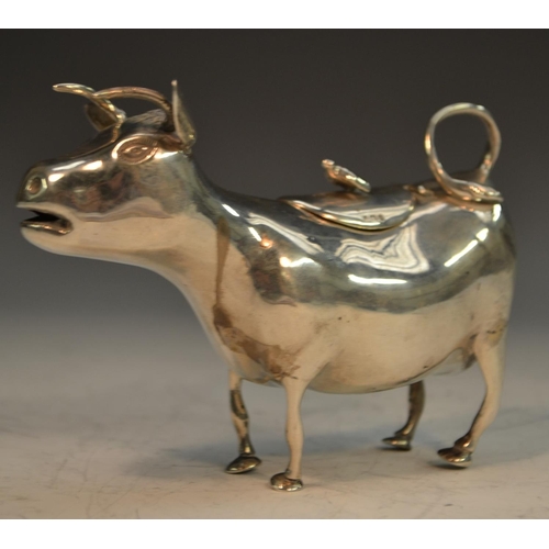 654 - A 19th century Continental silver cow creamer, in the manner of John Schuppe, 13cm long, import mark... 