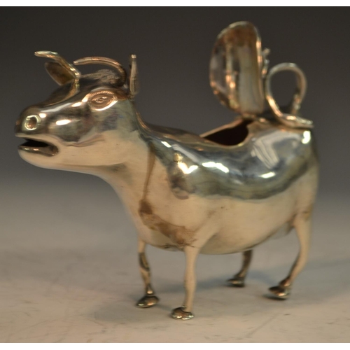 654 - A 19th century Continental silver cow creamer, in the manner of John Schuppe, 13cm long, import mark... 