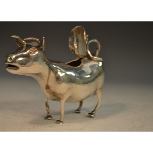 654 - A 19th century Continental silver cow creamer, in the manner of John Schuppe, 13cm long, import mark... 