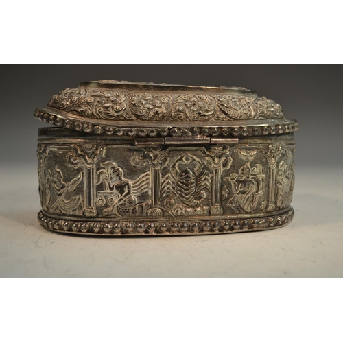 658 - A 19th century Indian silver rounded rectangular paan daan table-top box, hinged cover chased with a... 