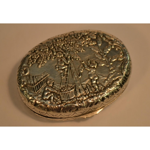 671 - A Dutch silver oval snuff box, embossed with putti frolicking and gathering fruit, 5.5cm wide, c.190... 