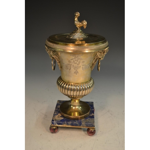 672 - A French Directoire silver-gilt half-fluted campana mantel urn, cockerel finial, caprine masks with ... 