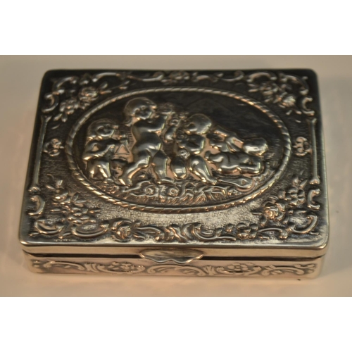 675 - A French silver rounded rectangular snuff box, hinged cover chased with frolicing putti, 7.5cm wide,... 