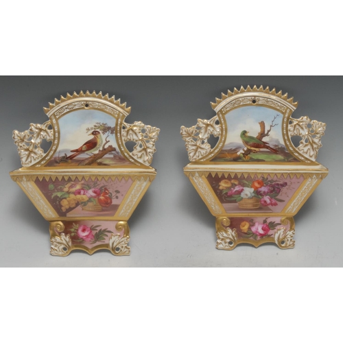 69 - A pair of  English porcelain wall pockets, attributed to Spode, finely painted with a basket of flow... 