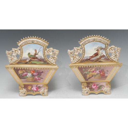 69 - A pair of  English porcelain wall pockets, attributed to Spode, finely painted with a basket of flow... 