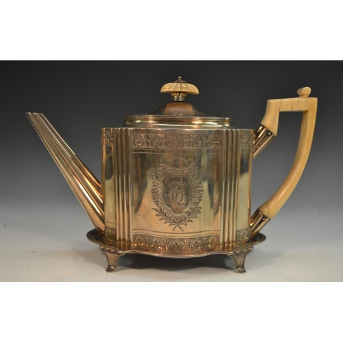 695 - A George III silver commode shaped teapot and stand, bright-cut engraved and outlined throughout wit... 