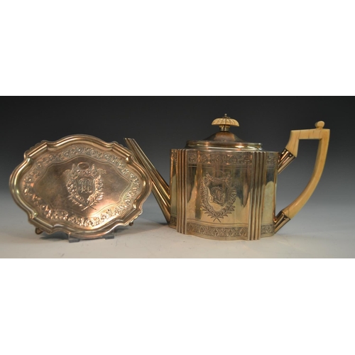 695 - A George III silver commode shaped teapot and stand, bright-cut engraved and outlined throughout wit... 