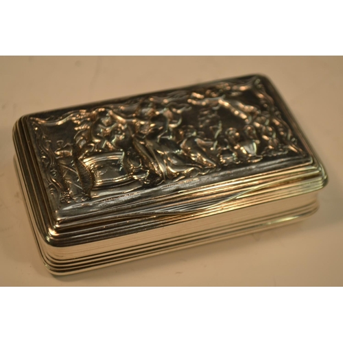 702 - A George III silver waisted rounded rectangular snuff box, hinged cover cast with a Classical scene,... 