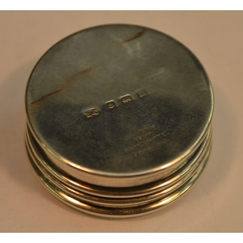 709 - A George V silver and enamel circular novelty pill box, push-fitting cover decorated with an armoria... 