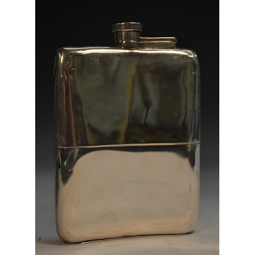 717 - A George V silver hip flask, hinged bayonet cap, stirrup cup to base, 15cm long, William Neale Ltd, ... 