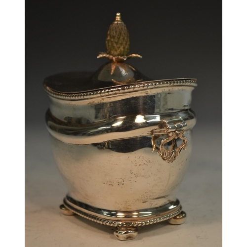 722 - A George V silver rounded rectangular tea caddy, hinged cover with pineapple finial, gadrooned borde... 