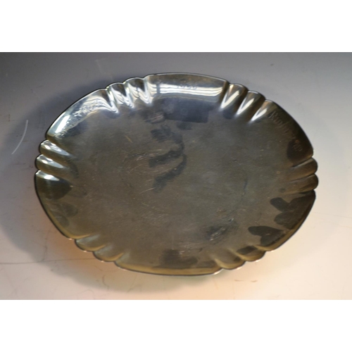 724 - A George V silver shaped circular footed dish, shaped rim, raised footring, 20.5cm diam, William Bat... 