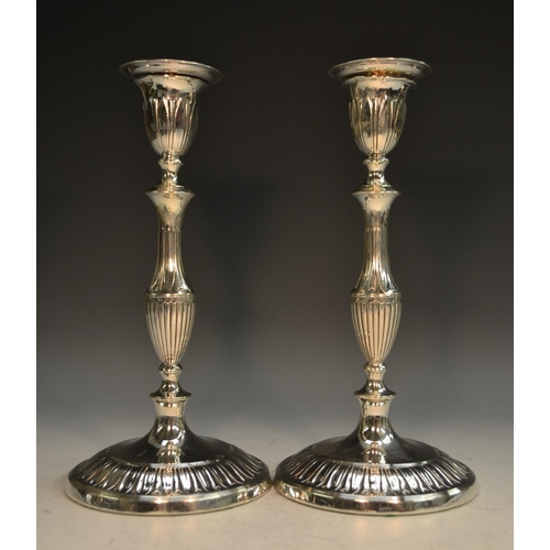 750 - A pair of Adam Revival silver table candlesticks, detachable sconces, baluster pillars, circular bas... 